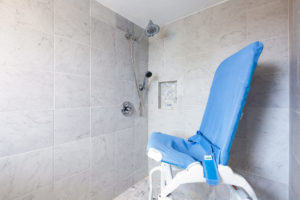 Smile Mass - Truro Retreat, accessible shower with shower chair inside