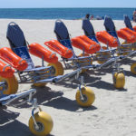 beach wheelchairs lined up- smile mass